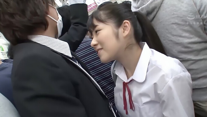 A young woman gives an elderly man a deep throat blowjob on a train