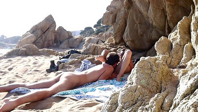 A couple's intimate moment interrupted by unexpected circumstances at the beach